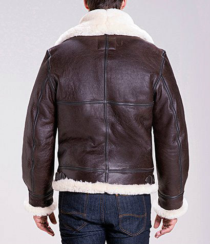 Back view of sheepskin shearling jacket on model with full, cream fur-lining and collar,  dark cross-stitching on the back