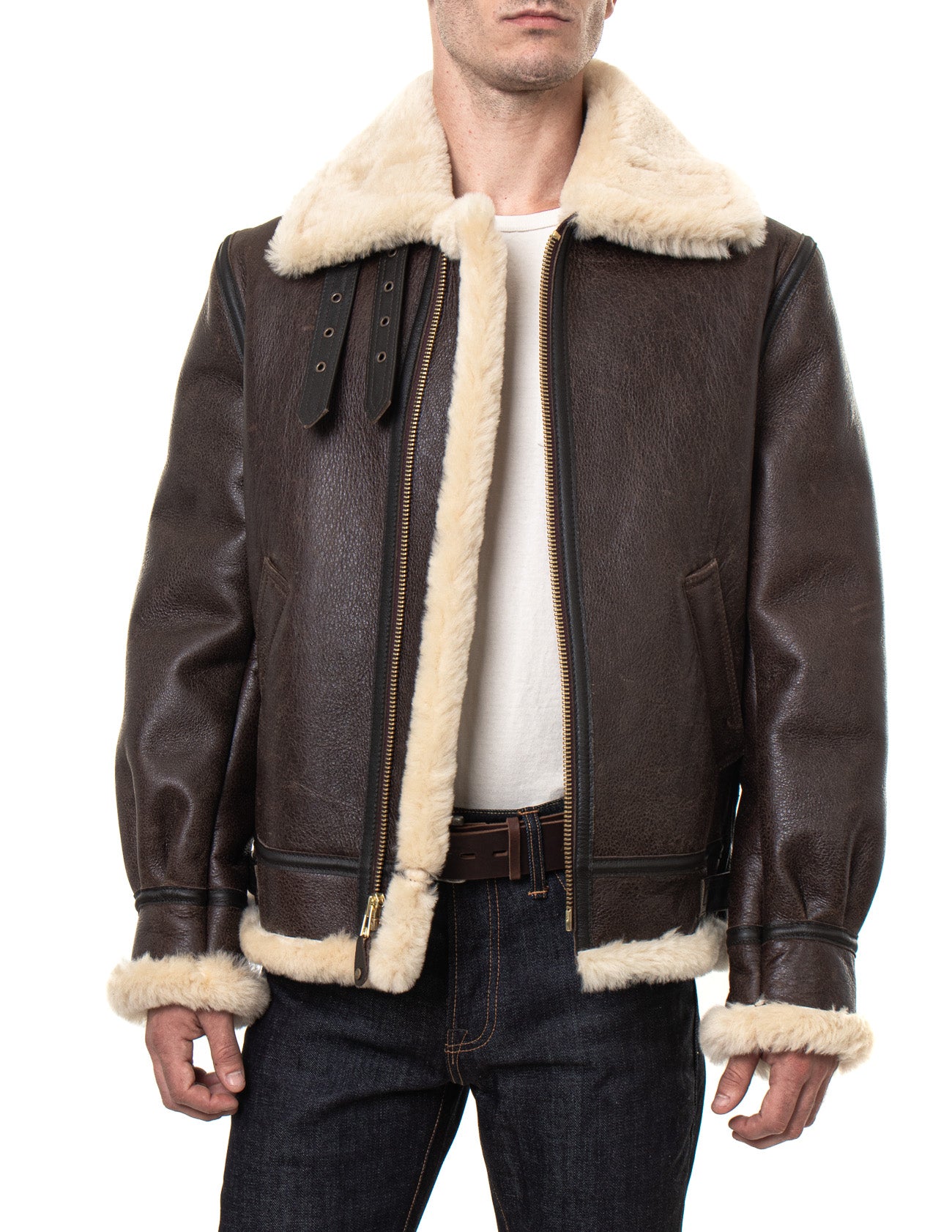 Front view of sheepskin shearling jacket on model with full, cream colored fur-lining and collar, unzipped front