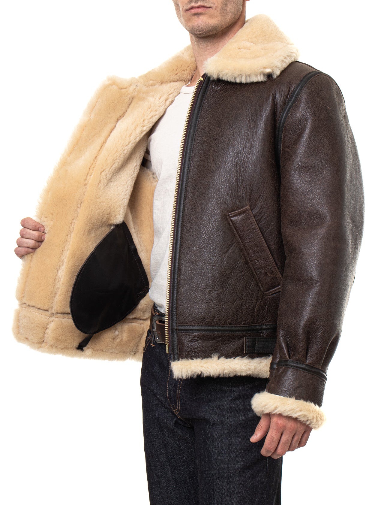 Sheepskin shearling jacket on model with cream fur-lining and collar, showing inside full fur-lining 