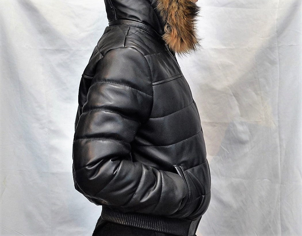 Sideway view of leather jacket on model with light puffer design and real fur hood. 